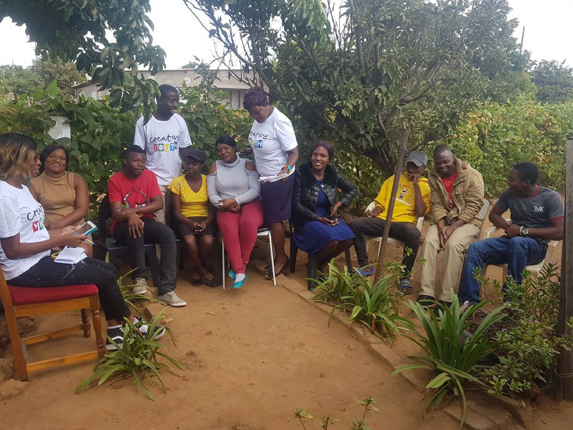 CYDev youth and community members meeting outdoors